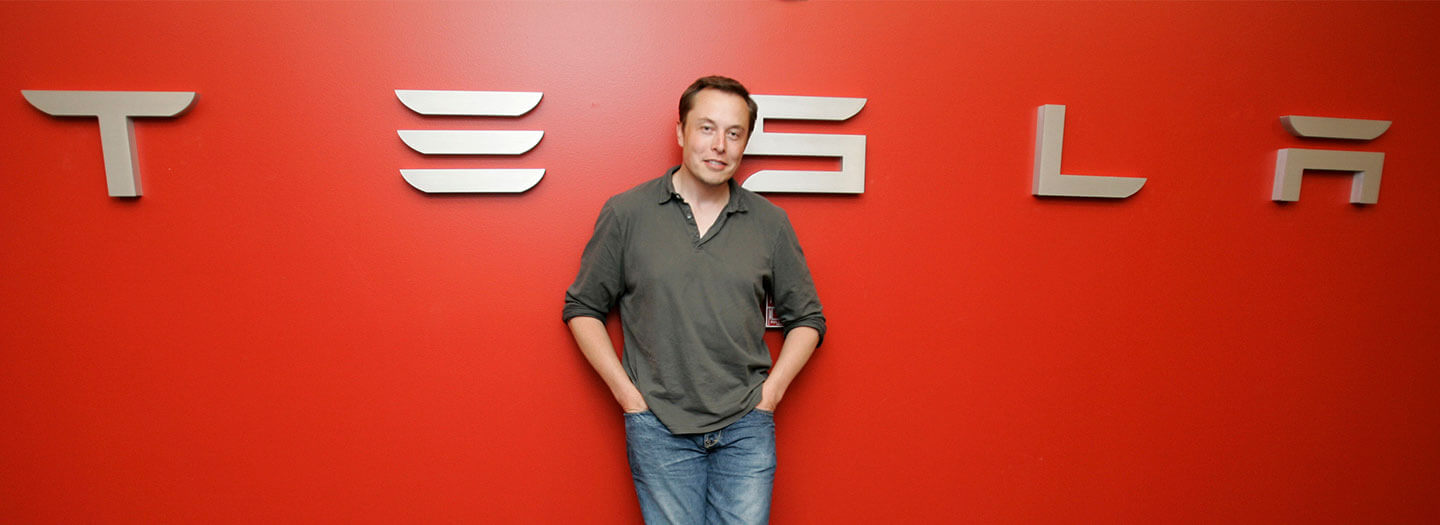 In this Tuesday, July 21, 2009 photo, Tesla CEO Elon Musk poses at Tesla headquarters in San Carlos, Calif. (AP Photo/Paul Sakuma)