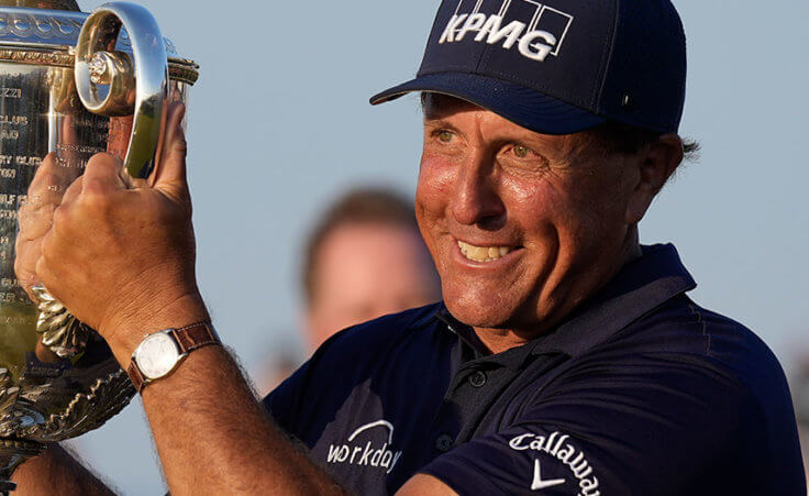 Phil Mickelson holds the Wanamaker Trophy after winning the PGA Championship golf tournament on the Ocean Course, Sunday, May 23, 2021, in Kiawah Island, S.C. (AP Photo/David J. Phillip)