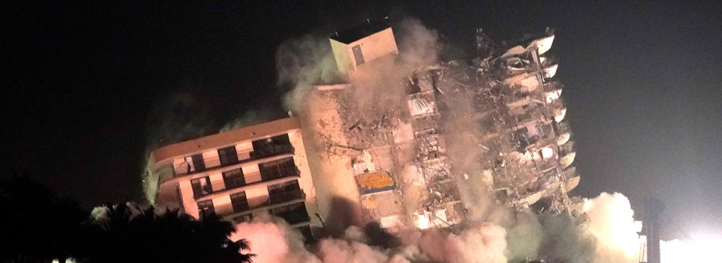 The remaining structure of the Champlain Towers South condo building is demolished more than a week after it partially collapsed, Sunday, July 4, 2021, in Surfside, Fla. (AP Photo/Lynne Sladky)