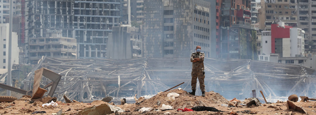 A soldier stands at the devastated site of the explosion in the port of Beirut, Lebanon, Thursday, Aug. 6, 2020.