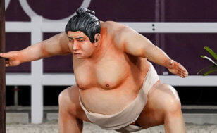 closeup of sumo wrestling statue at equestrian Olympics event