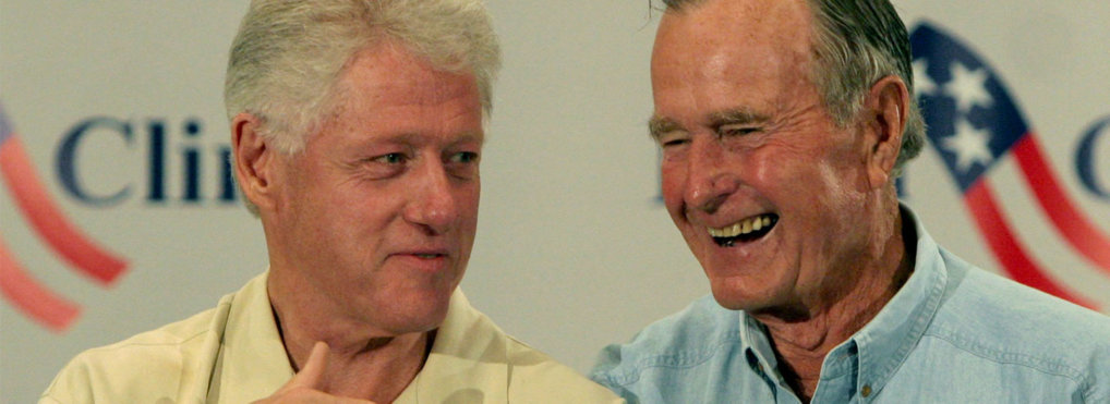 Former Presidents Bill Clinton, left, and George H.W. Bush joke during a press conference in Houston Monday, Sept. 5, 2005, before meeting with Hurricane Katrina refugees.