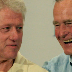 Former Presidents Bill Clinton, left, and George H.W. Bush joke during a press conference in Houston Monday, Sept. 5, 2005, before meeting with Hurricane Katrina refugees.