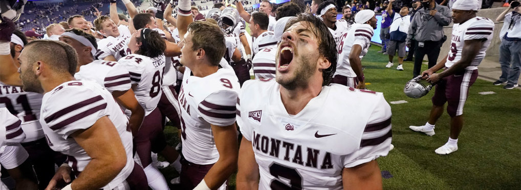 Montana quarterback Cam Humphrey lets out a yell as he celebrates with teammates after they beat Washington in an NCAA college football game Saturday, Sept. 4, 2021, in Seattle. Montana won 13-7. (AP Photo/Elaine Thompson)