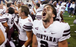 Montana quarterback Cam Humphrey lets out a yell as he celebrates with teammates after they beat Washington in an NCAA college football game Saturday, Sept. 4, 2021, in Seattle. Montana won 13-7. (AP Photo/Elaine Thompson)