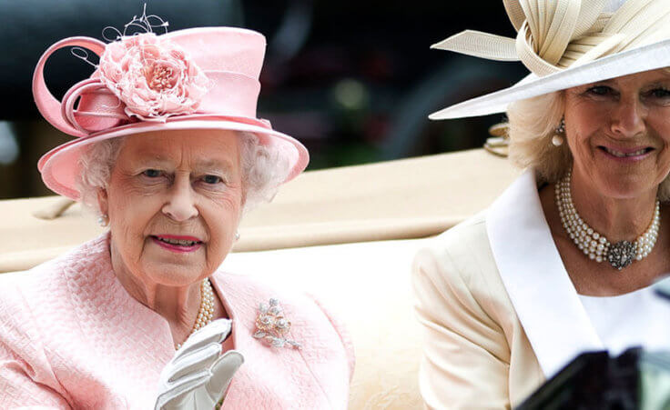 FILE - Britain's Queen Elizabeth II waves to the crowds with Camilla, Duchess of Cornwall at right, as they arrive by carriage on the first day of the Royal Ascot horse race meeting in Ascot, England, Tuesday, June 18, 2013. (AP Photo/Alastair Grant, File)