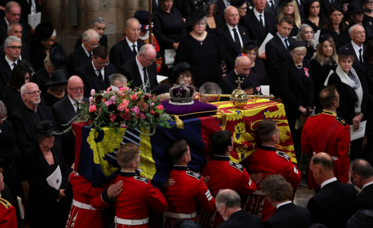 Britain's Queen Elizabeth's coffin is carried inside the Westminster Abbey, during her funeral in London, Monday Sept. 19, 2022. (Phil Noble/Pool Photo via AP)