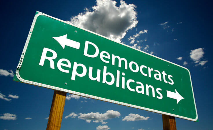 Stock photo: A green road sign against clouds in a blue sky points Democrats to the left and Republicans to the right. © Andy Dean