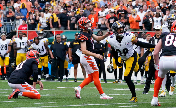 Cincinnati Bengals place kicker Evan McPherson, left, has an extra point blocked by Pittsburgh Steelers' Minkah Fitzpatrick during an NFL football game, Sunday, Sept. 11, 2022, in Cincinnati. (AP Photo/Jeff Dean)