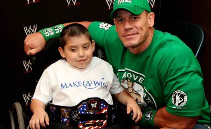 In this Monday, June 18, 2012 photo, seven-year old, Jonny Littman, poses with WWE superstar, John Cena, at the 300th Make-A-Wish for Cena in Uniondale, N.Y. It was the 300th wish granted by Cena, making him the most popular celebrity granter in Make-A-Wish history. (AP Photo/John Carucci)