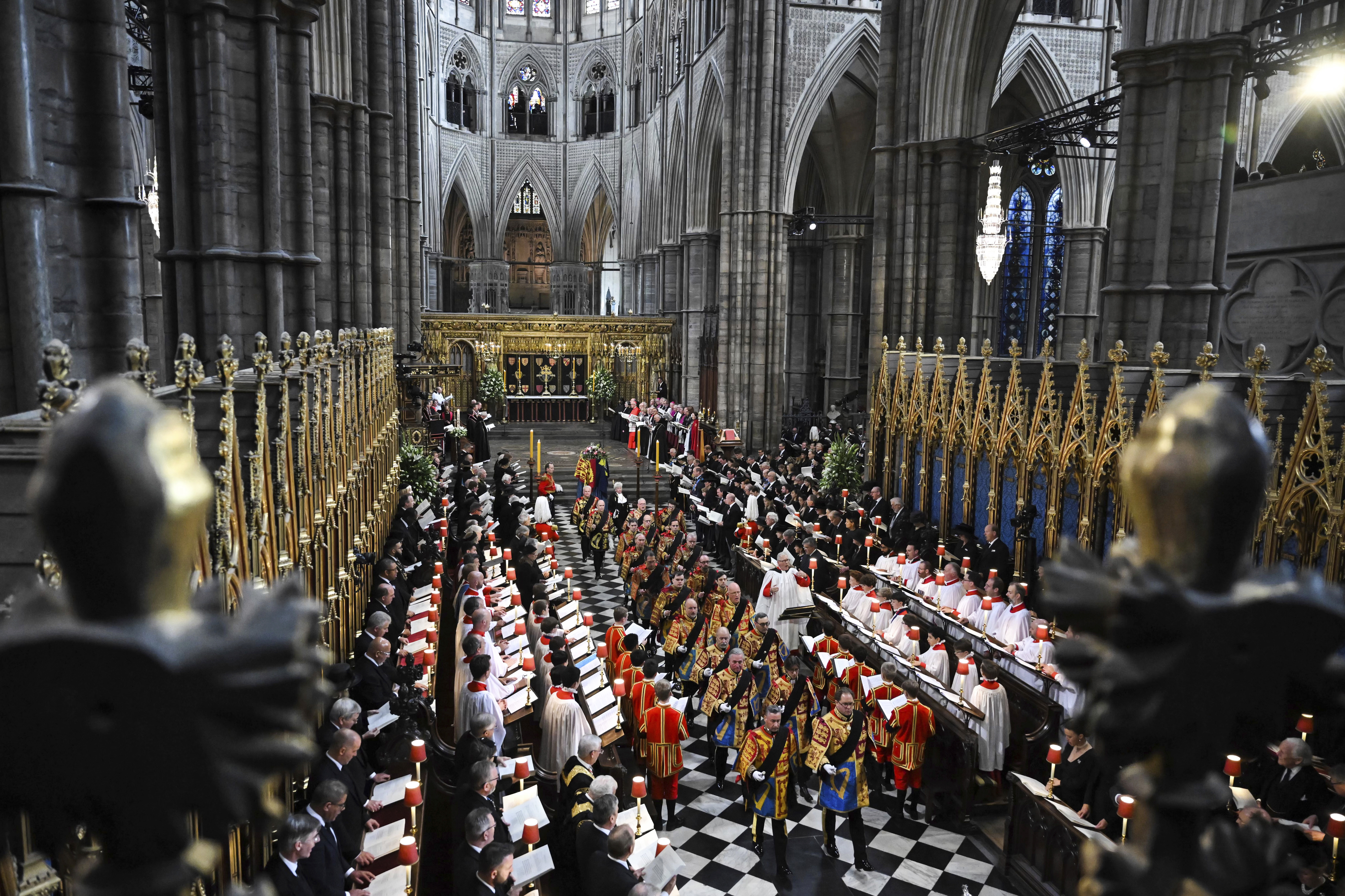 The funeral of Queen Elizabeth II in Westminster Abbey in central London, Monday Sept. 19, 2022. The Queen, who died aged 96 on Sept. 8, will be buried at Windsor alongside her late husband, Prince Philip, who died last year. (Ben Stansall/Pool via AP)