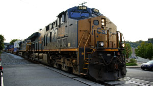 A CSX freight train runs through a crossing in Homestead, Pa., on Wednesday, Sept. 14, 2022. (AP Photo/Gene J. Puskar)