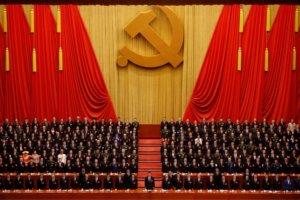 Chinese President Xi Jinping, front row center, stands with his cadres during the Communist song at the closing ceremony for the 19th Party Congress at the Great Hall of the People in Beijing