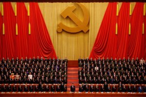 Chinese President Xi Jinping, front row center, stands with his cadres during the Communist song at the closing ceremony for the 19th Party Congress at the Great Hall of the People in Beijing