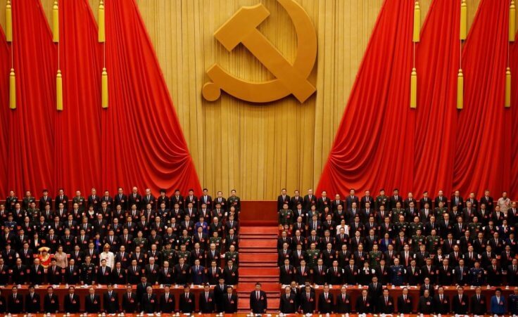 Chinese President Xi Jinping, front row center, stands with his cadres during the Communist song at the closing ceremony for the 19th Party Congress at the Great Hall of the People in Beijing
