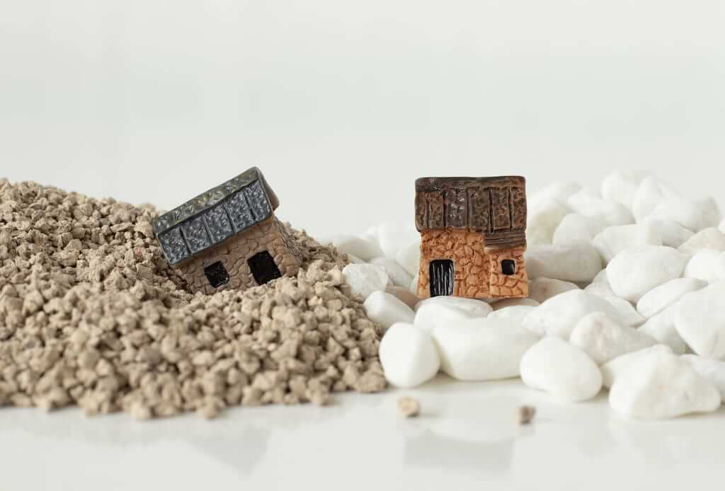 Miniature houses on sand and rocks, parable of Jesus