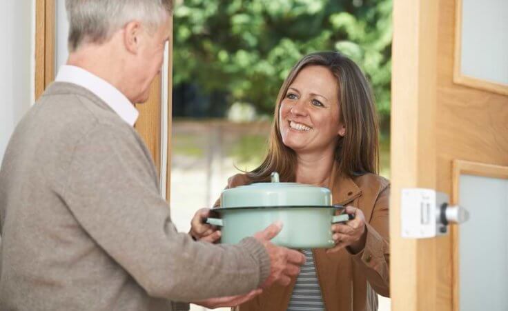 Woman brings neighbor food