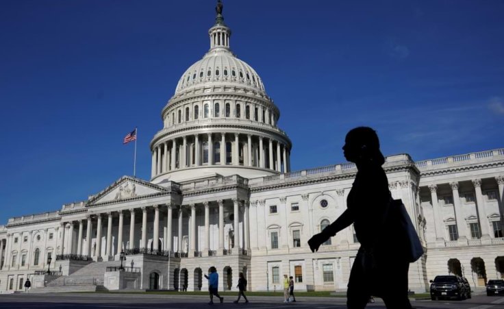 People walk outside the U.S Capitol building in Washington, Thursday, June 9, 2022.