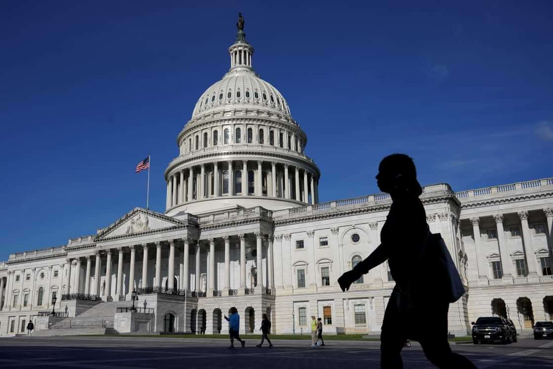 People walk outside the U.S Capitol building in Washington, Thursday, June 9, 2022.