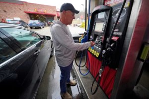 Darryl Matevish of Sewickley, Pa., fills his car with regular unleaded gas at $4.19.9 per gallon at a Sheetz store in Sewickley, Pa., Monday, March 7, 2022. For Thanksgiving 2022, the chain has lowered prices on Unleaded 88 to $1.99/gallon. (AP Photo/Gene J. Puskar)