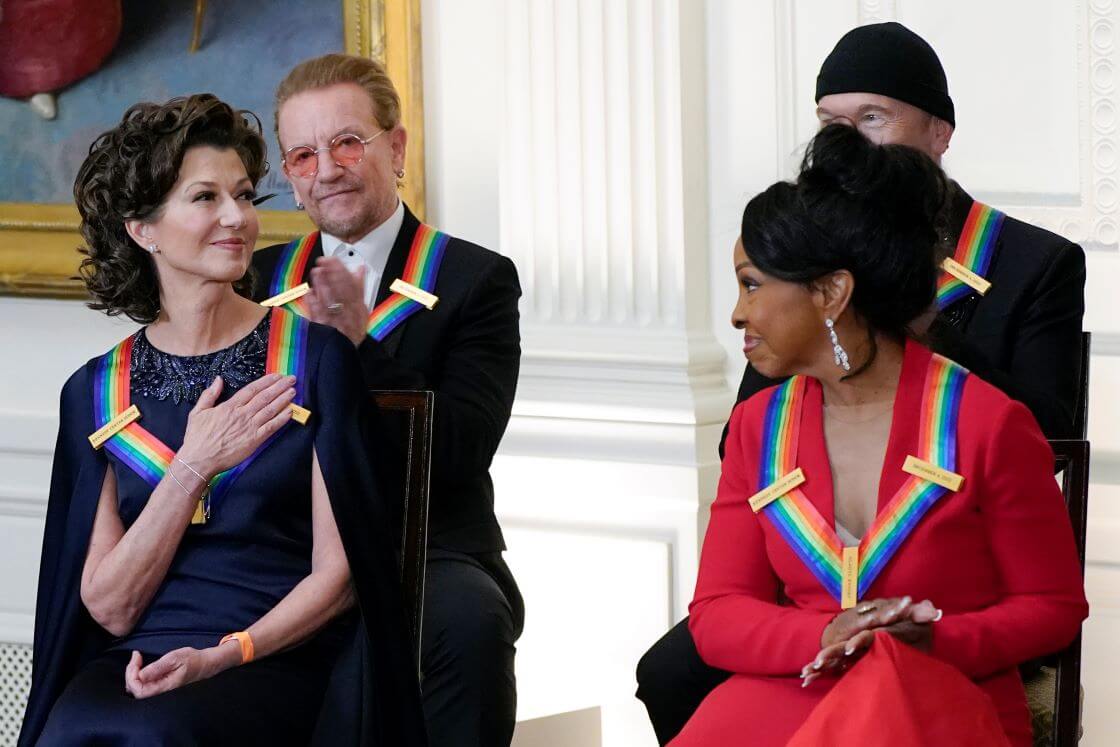 Contemporary Christian singer Amy Grant, left, reacts as she is recognized by President Joe Biden during the Kennedy Center honorees reception at the White House in Washington, Sunday, Dec. 4, 2022. The 2022 Kennedy Center Honorees are from left, Amy Grant, Bono, Gladys Knight, and The Edge. (AP Photo/Manuel Balce Ceneta)