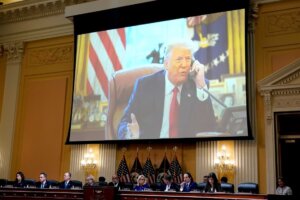 A video of former President Donald Trump is shown on a screen, as the House select committee investigating the Jan. 6 attack on the U.S. Capitol holds its final meeting on Capitol Hill in Washington, Monday, Dec. 19, 2022. From left to right, Rep. Stephanie Murphy, D-Fla., Rep. Pete Aguilar, D-Calif., Rep. Adam Schiff, D-Calif., Rep. Zoe Lofgren, D-Calif., Chairman Bennie Thompson, D-Miss., Vice Chair Liz Cheney, R-Wyo., Rep. Adam Kinzinger, R-Ill., Rep. Jamie Raskin, D-Md., and Rep. Elaine Luria, D-Va. (AP Photo/J. Scott Applewhite)