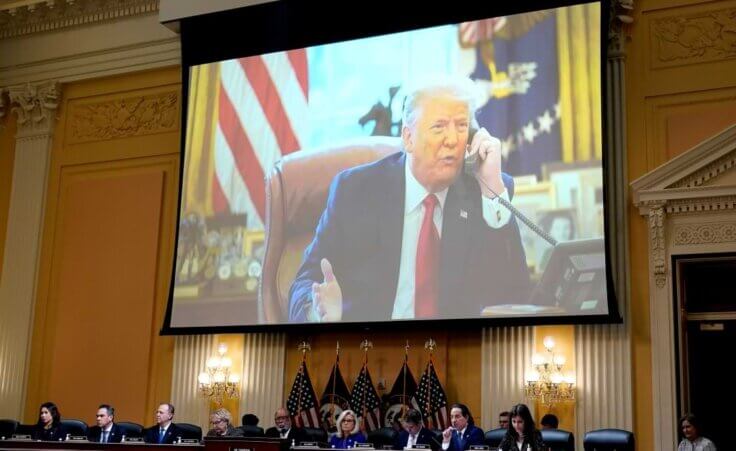 A video of former President Donald Trump is shown on a screen, as the House select committee investigating the Jan. 6 attack on the U.S. Capitol holds its final meeting on Capitol Hill in Washington, Monday, Dec. 19, 2022. From left to right, Rep. Stephanie Murphy, D-Fla., Rep. Pete Aguilar, D-Calif., Rep. Adam Schiff, D-Calif., Rep. Zoe Lofgren, D-Calif., Chairman Bennie Thompson, D-Miss., Vice Chair Liz Cheney, R-Wyo., Rep. Adam Kinzinger, R-Ill., Rep. Jamie Raskin, D-Md., and Rep. Elaine Luria, D-Va. (AP Photo/J. Scott Applewhite)