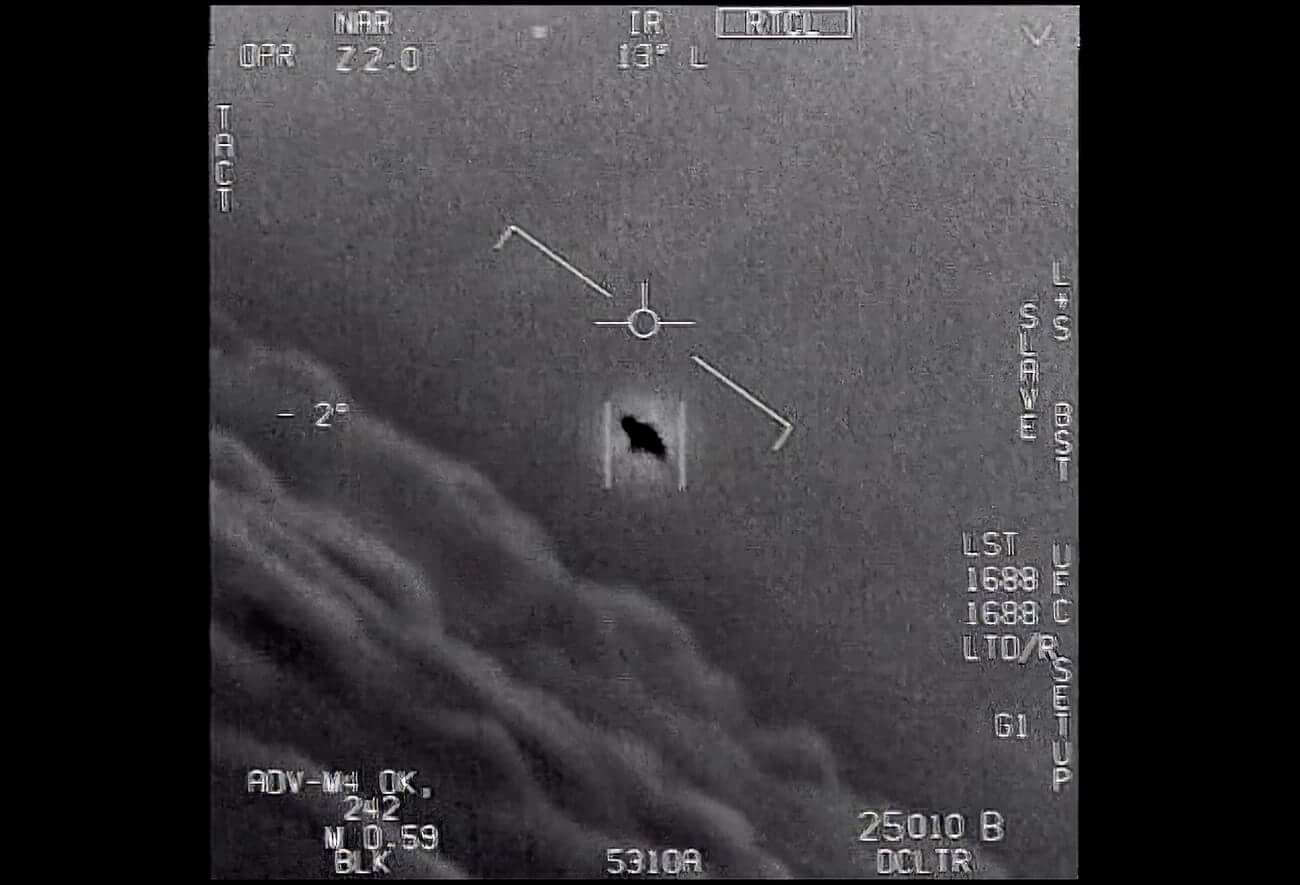 Are aliens real? The image from video provided by the Department of Defense labelled Gimbal, from 2015, an unexplained object is seen at center as it is tracked as it soars high along the clouds, traveling against the wind. “There's a whole fleet of them,” one naval aviator tells another, though only one indistinct object is shown. “It's rotating." The U.S. government has been taking a hard look at unidentified flying objects, under orders from Congress, and a report summarizing what officials know is expected to come out in June 2021. (Department of Defense via AP)