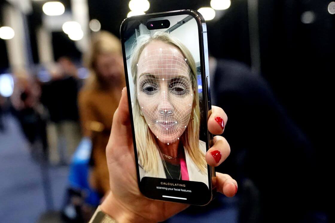 A booth worker demonstrates L'Oreal's smart brow applicator that uses augmented reality to help print eyebrows on the face during CES Unveiled, before the CES tech show, Tuesday, Jan. 3, 2023, in Las Vegas. (AP Photo/Rick Bowmer)