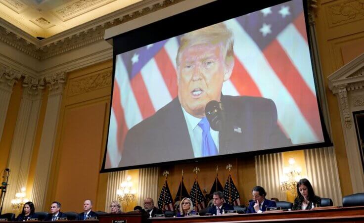 FILE - A video of former President Donald Trump is shown on a screen, as the House select committee investigating the Jan. 6 attack on the U.S. Capitol holds its final meeting on Capitol Hill in Washington, Dec. 19, 2022. From left to right, Rep. Stephanie Murphy, D-Fla., Rep. Pete Aguilar, D-Calif., Rep. Adam Schiff, D-Calif., Rep. Zoe Lofgren, D-Calif., Chairman Bennie Thompson, D-Miss., Vice Chair Liz Cheney, R-Wyo., Rep. Adam Kinzinger, R-Ill., Rep. Jamie Raskin, D-Md., and Rep. Elaine Luria, D-Va. (AP Photo/J. Scott Applewhite, File)