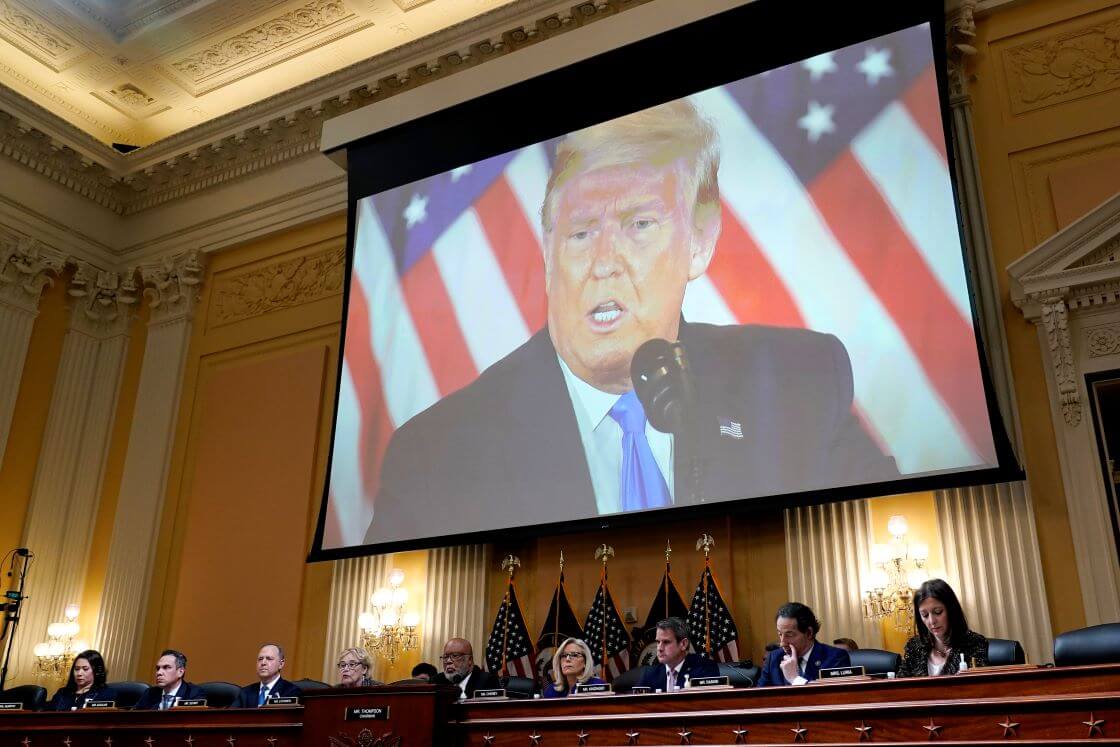 FILE - A video of former President Donald Trump is shown on a screen, as the House select committee investigating the Jan. 6 attack on the U.S. Capitol holds its final meeting on Capitol Hill in Washington, Dec. 19, 2022. From left to right, Rep. Stephanie Murphy, D-Fla., Rep. Pete Aguilar, D-Calif., Rep. Adam Schiff, D-Calif., Rep. Zoe Lofgren, D-Calif., Chairman Bennie Thompson, D-Miss., Vice Chair Liz Cheney, R-Wyo., Rep. Adam Kinzinger, R-Ill., Rep. Jamie Raskin, D-Md., and Rep. Elaine Luria, D-Va. (AP Photo/J. Scott Applewhite, File)