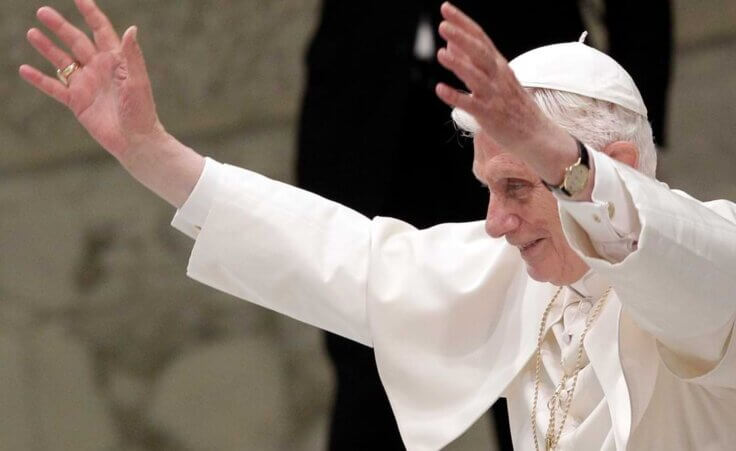 FILE - Pope Benedict XVI waves during an audience to newly appointed archbishops, the day after they received the pallium, a woolen shawl symbolizing their bond to the pope, at the Paul VI hall, Vatican, Saturday, June 30, 2012. (AP Photo/Riccardo De Luca)