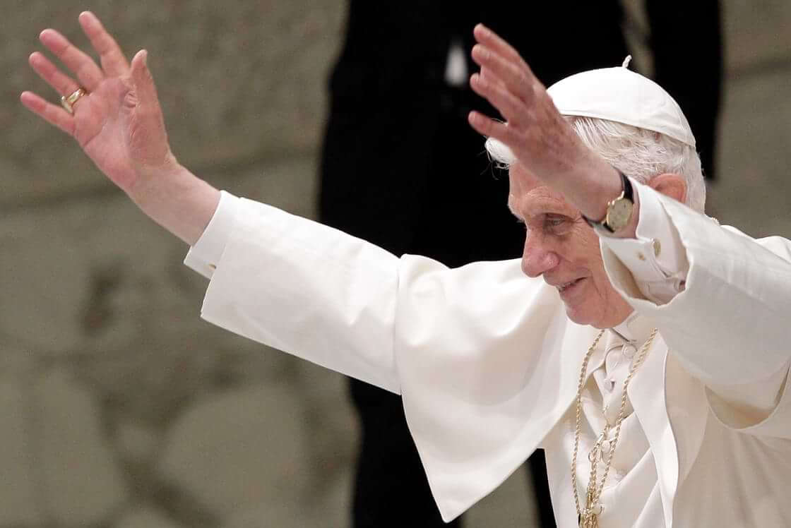 FILE - Pope Benedict XVI waves during an audience to newly appointed archbishops, the day after they received the pallium, a woolen shawl symbolizing their bond to the pope, at the Paul VI hall, Vatican, Saturday, June 30, 2012. (AP Photo/Riccardo De Luca)