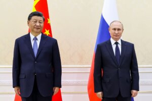 Chinese President Xi Jinping, left, and Russian President Vladimir Putin pose for a photo on the sidelines of the Shanghai Cooperation Organization (SCO) summit in Samarkand, Uzbekistan, Thursday, Sept. 15, 2022. (Alexandr Demyanchuk, Sputnik, Kremlin Pool Photo via AP)