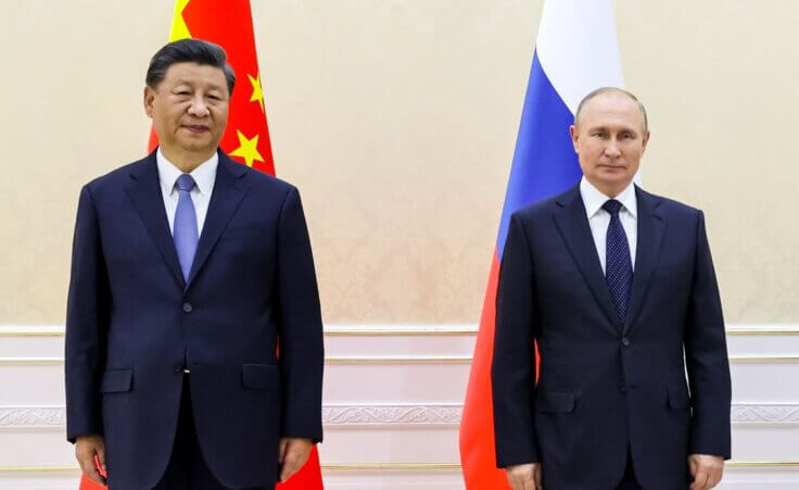 Chinese President Xi Jinping, left, and Russian President Vladimir Putin pose for a photo on the sidelines of the Shanghai Cooperation Organization (SCO) summit in Samarkand, Uzbekistan, Thursday, Sept. 15, 2022. (Alexandr Demyanchuk, Sputnik, Kremlin Pool Photo via AP)