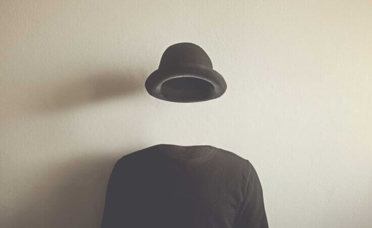 An invisible man wears a black bowler hat and black sweater. © By fran_kie/stock.adobe.com