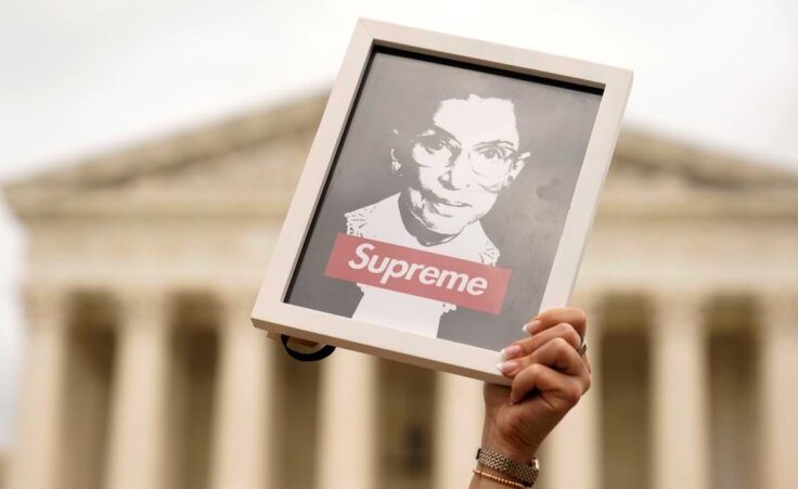 A protester holds up an image of late Supreme Court Justice Ruth Bader Ginsburg outside of the U.S. Supreme Court, Thursday, May 5, 2022, during a demonstration in Washington. (AP Photo/Mariam Zuhaib). Note: This is not the sculpture mentioned in the accompanying article.