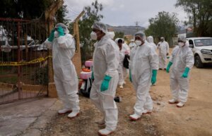 Health workers in protective gear enter a chicken farm during a health alert due to a bird flu outbreak in Sacaba, Bolivia, Tuesday, Jan. 31, 2023. Bolivian health authorities reported on Jan. 30 that thousands of birds were culled after an outbreak of bird flu on farms, forcing the declaration of a 120-day health emergency. (AP Photo/Juan Karita)