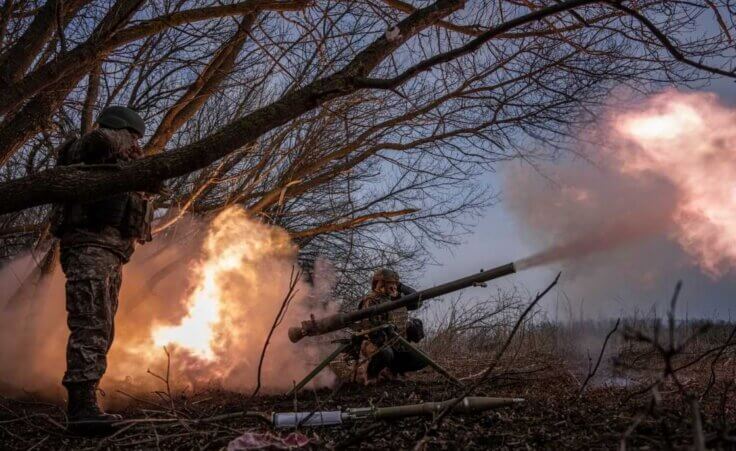 Ukrainian servicemen of 68 OleksaDovbush hunting brigade fire a rocket by SPG-9 towards Russian positions at the frontline near Vuhledar, Ukraine, Wednesday, Feb. 22, 2023. (AP Photo/Evgeniy Maloletka)