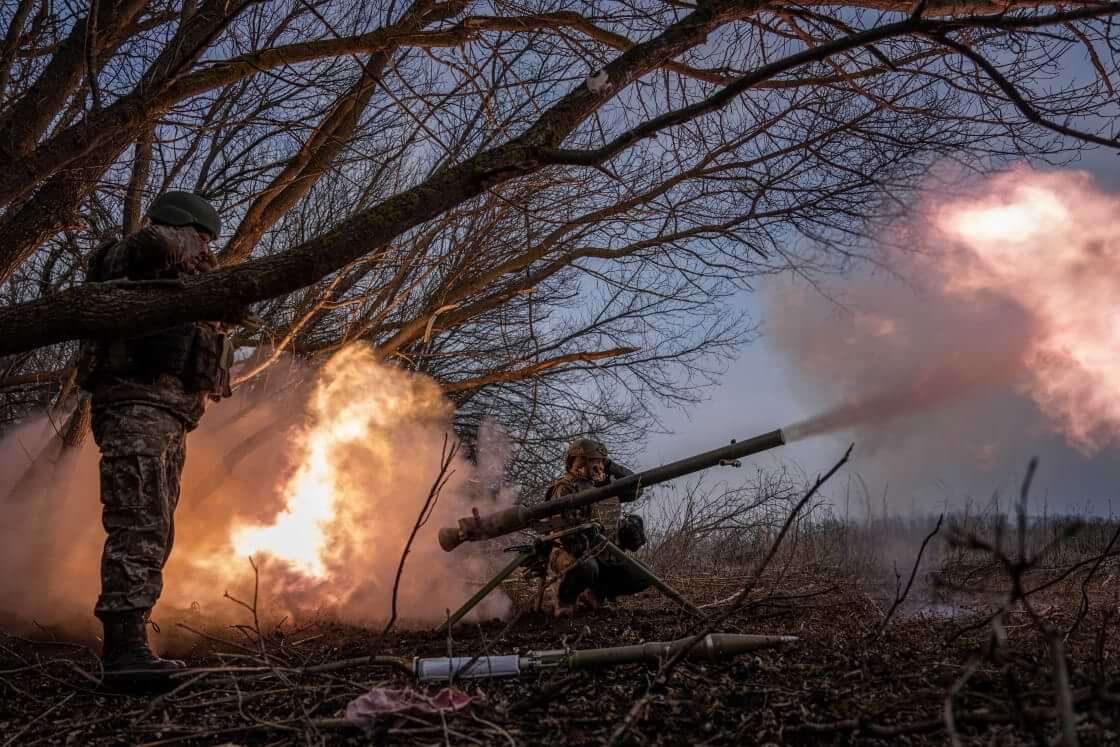 Ukrainian servicemen of 68 OleksaDovbush hunting brigade fire a rocket by SPG-9 towards Russian positions at the frontline near Vuhledar, Ukraine, Wednesday, Feb. 22, 2023. (AP Photo/Evgeniy Maloletka)