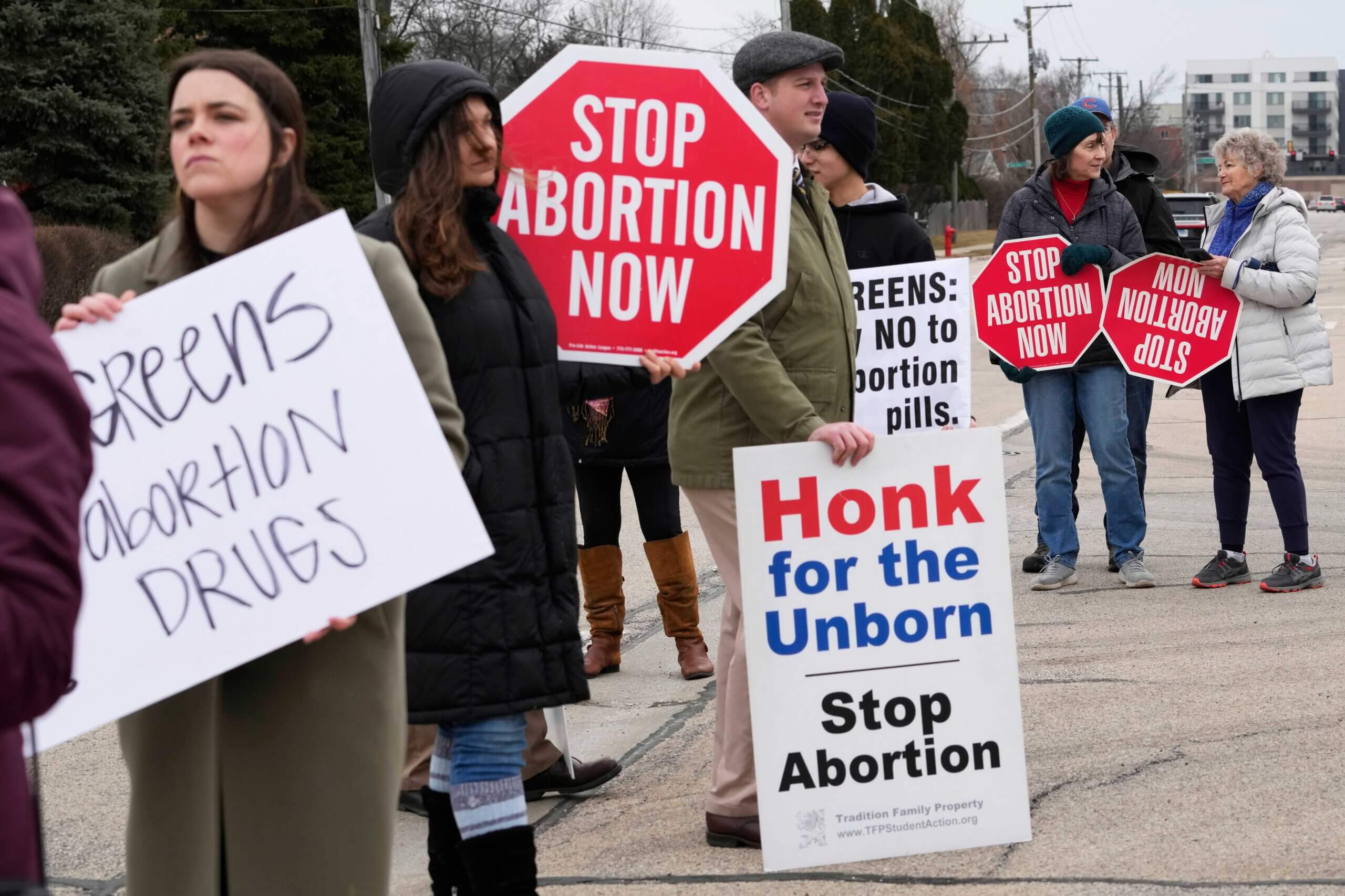 Anti-abortion groups protest near the Walgreens Deerfield headquarters over a plan to sell abortion pills in Deerfield, Ill., Tuesday, Feb. 14, 2023.