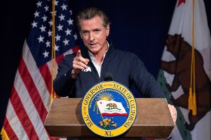 FILE - California Gov. Gavin Newsom speaks in Sacramento, Calif., Jan. 10, 2023. On Wednesday, March 8, 2023, Newsom announced he would not renew a state contract with Walgreens after the company indicated it would not sell abortion pills in some conservative-led states. (AP Photo/José Luis Villegas, File). Actions like this are leading some cities and communities in the United States to consider secession.