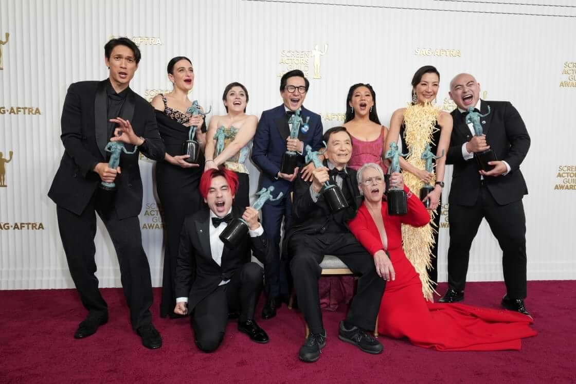 Harry Shum Jr., from back left, Jenny Slate, Tallie Medel, Ke Huy Quan, Stephanie Hsu, Michelle Yeoh, Brian Le, Andy Le, from front left, James Hong, and Jamie Lee Curtis pose with the award for outstanding performance by a cast in a motion pictures for "Everything Everywhere All at Once," in the press room at the 29th annual Screen Actors Guild Awards on Sunday, Feb. 26, 2023, at the Fairmont Century Plaza in Los Angeles. (Photo by Jordan Strauss/Invision/AP). The film is a 2023 Oscar Best Picture nominee.