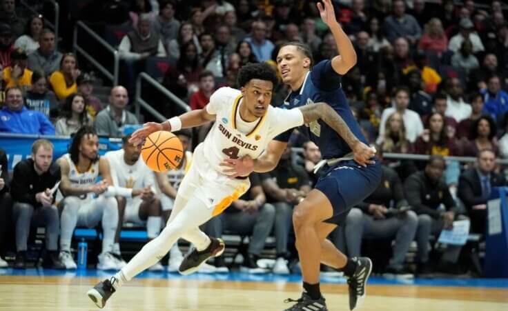 Arizona State's Desmond Cambridge Jr. (4) goes to the basket against Nevada's Darrion Williams (5) during the second half of a First Four college basketball game in the NCAA men's basketball tournament, aka March Madness, on Wednesday, March 15, 2023, in Dayton, Ohio. (AP Photo/Darron Cummings)