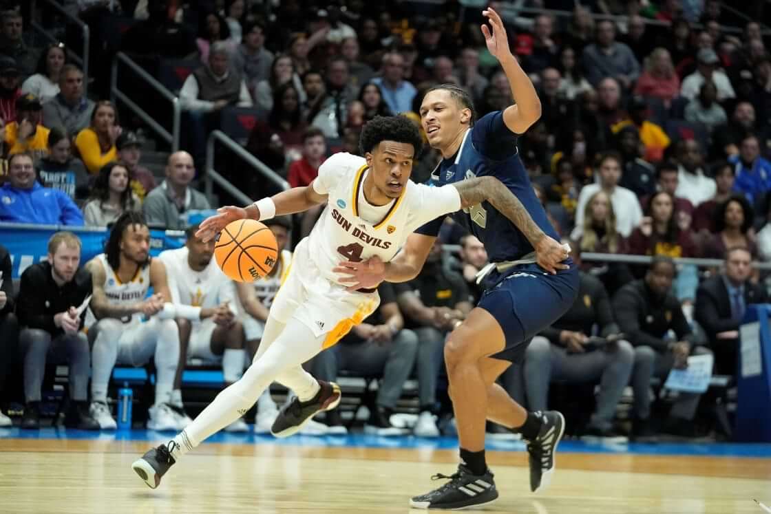 Arizona State's Desmond Cambridge Jr. (4) goes to the basket against Nevada's Darrion Williams (5) during the second half of a First Four college basketball game in the NCAA men's basketball tournament, aka March Madness, on Wednesday, March 15, 2023, in Dayton, Ohio. (AP Photo/Darron Cummings)