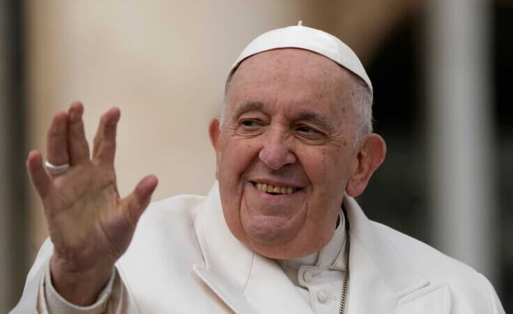 Pope Francis waves to faithful during his weekly general audience in St. Peter's Square.