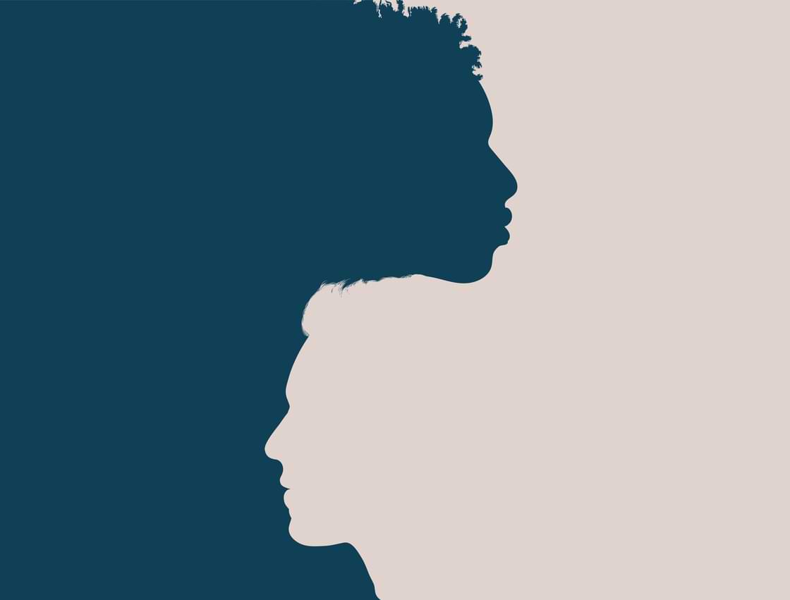 Racial unity. Profile head silhouette of African American man intersecting into another Caucasian man.