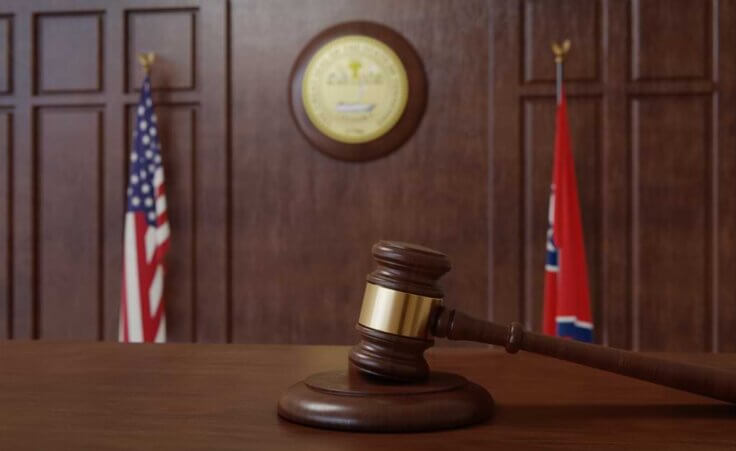 Courtroom with US flag and Tennessee's flag side by side. Tennessee passes law limited drag shows