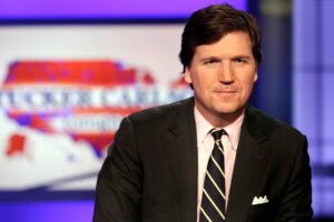 Tucker Carlson, host of "Tucker Carlson Tonight," poses for photos in a Fox News Channel studio, in New York.