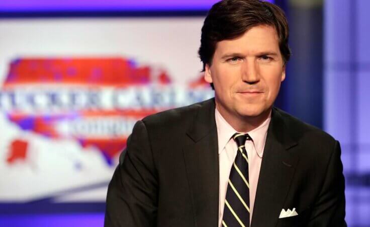 Tucker Carlson, host of "Tucker Carlson Tonight," poses for photos in a Fox News Channel studio, in New York.